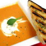 Savor the Classic: Creamy Tomato Basil Soup with Grilled Cheese