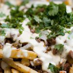Savor Carne Asada Fries Topped with Creamy Queso Fresco